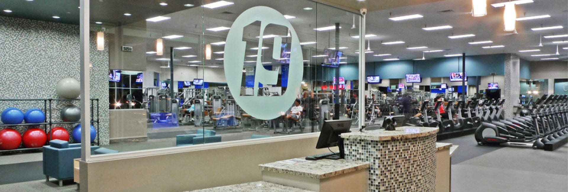 front desk of a modern gym Fitness 19 in Grand Rapids